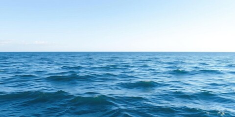 Obraz premium A serene ocean background with gentle waves and a clear blue sky, perfect for relaxation and inspiration, sea, peaceful