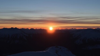 Sun setting over snow-covered peaks in the Scandinavian mountain range, peaks, nature