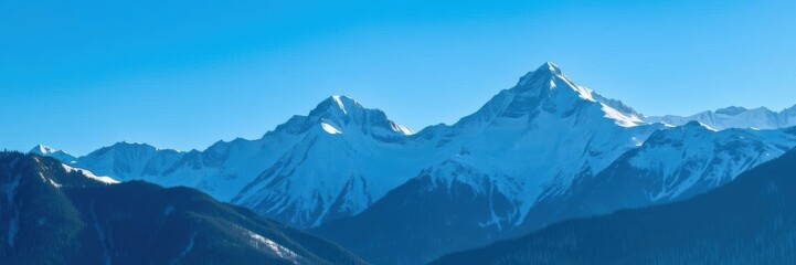 Fototapeta premium Snow-capped mountains towering under a clear blue sky, white, cold
