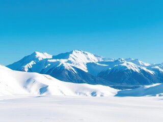 Snow-capped mountains in Alaska with a clear blue sky, high, rocky