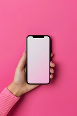 hand holding phone with white screen isolated on pink background mockup