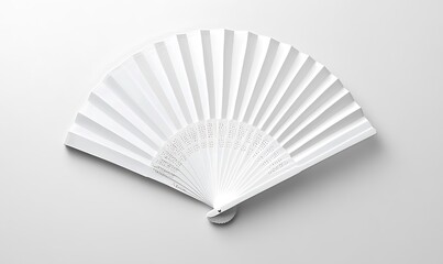 White folding hand fan set apart against a white background