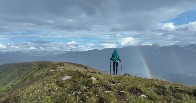 Woman hiking on high altitude mountain top