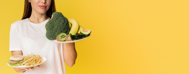 Healthy Vs Unhealthy. Unrecognizable lady choosing between plates with organic fruits and...