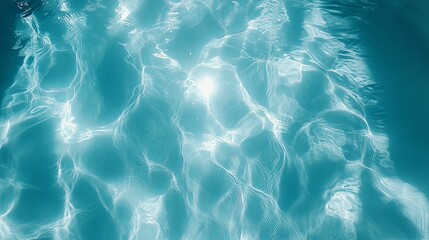 Abstract Pattern of Sunlit Ripples on Turquoise Water