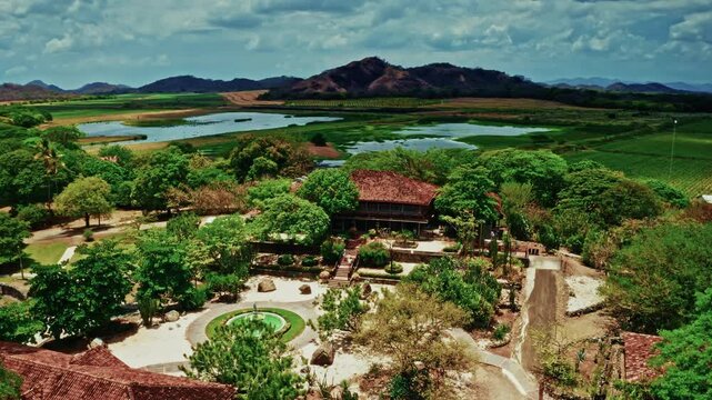 Aerial drone shot over la Hacienda el Viejo Wetlands in Guanacaste, Costa Rica. High view of the lush vegetation and the green landscape.