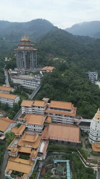 vertical Drone close up kek lok si temple Penang island Malaysia aerial jungle