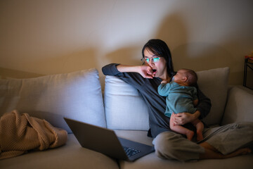 Working Mother Holding Baby at Night