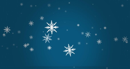 Digital image of snowflakes icons falling against copy space on blue background