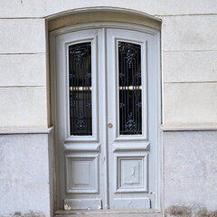 Vintage double door with ornate details and a weathered patina. Perfect for nostalgic, vintage, and rustic themes.