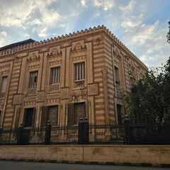 Historic building with intricate stonework and a grand facade. Perfect for architecture, history, and travel-themed projects.