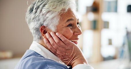 Senior woman, home and happy with hearing aid on ear for audio, listening and healthcare as...
