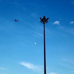lamp post against blue sky
