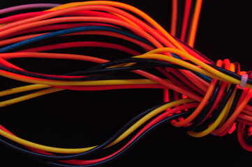Tangled wires on black, backdrop