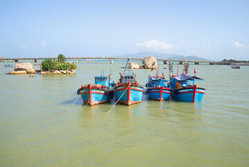 Four fishing schooners at the mouth of the Kai River. Nha Trang, Vietnam