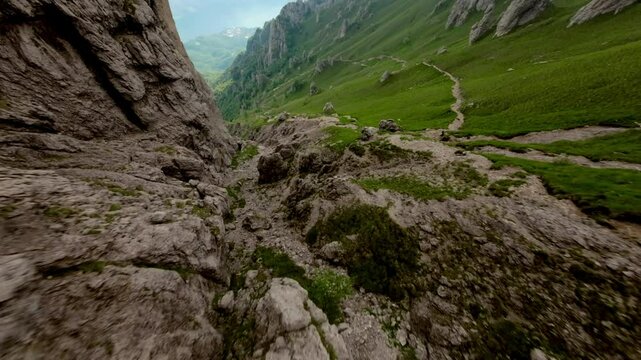 Mountainous landscape during summer season, green meadows, Grignetta mountain, Italian Alps, Aerial drone fpv