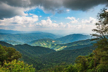 Scenic nature landscape surrounded by Mountains and a Beautiful cloudy Sky at Nan, Thailand