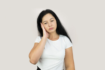 Fototapeta premium young woman, girl with headache or migraine, suffering from dizziness, holding head with hands, health