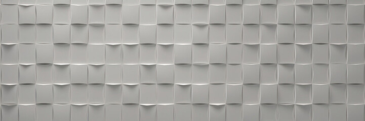 A wall made of square tiles with a silver color