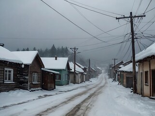 Snow-covered street in a small town with power lines overhead