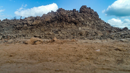Detailed Shot of Excavated Earth Piled on the Side of Construction Site