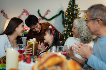 Dinner and Family holiday celebrating, together at Merry Christmas and  New Year. in a cozy festive home setting.