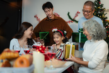 Dinner and Family holiday celebrating, together at Merry Christmas and  New Year. in a cozy festive home setting.