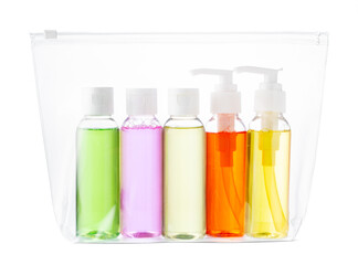 A clear travel pouch filled with vibrant toiletry bottles isolated on white