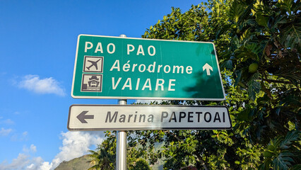 Fototapeta premium Close up of street sign for airport, ferry port harbour, and marina on tropical island of Moorea, French Polynesia in South Pacific