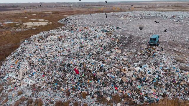 Aerial view of a large rural landfill with mixed waste and debris