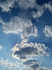 
Blue sky and white puffy clouds