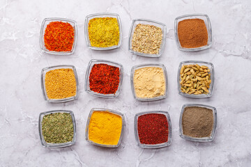 A vibrant assortment of various spices and herbs displayed together