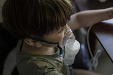 A young child using a nebulizer mask for asthma and respiratory treatment, highlighting the importance of pediatric care in managing respiratory conditions