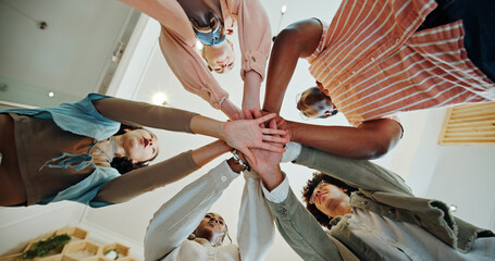 College, students and stack of hands for education, academic project and support for studying as team. Campus, people and friends with huddle for exam success, solidarity and celebration by low angle