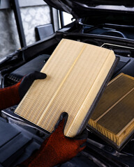 Replacing air filter in automotive engine , Car maintenance concept