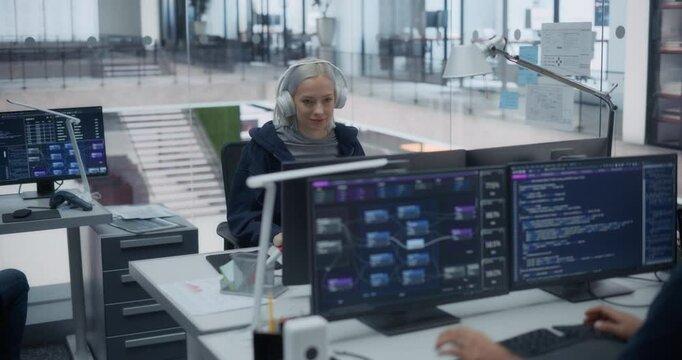 Professional QA Engineer Working on Bugs in a Software Before the Launch, Collaborating with Developers Online. Female Quality Specialist and Colleagues Working in Artificial Intelligence Industry