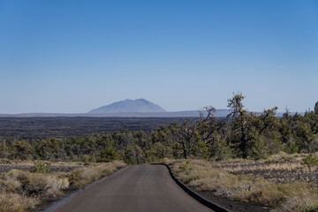 Craters of the Moon National Monument and Preserve, Idaho. Snake River Plain. In the distance is the Big Southern Butte (Lava dome). © youli zhao