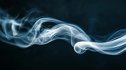 Fototapeta premium A delicate white smoke curl rising softly, creating a gentle atmosphere on a black background