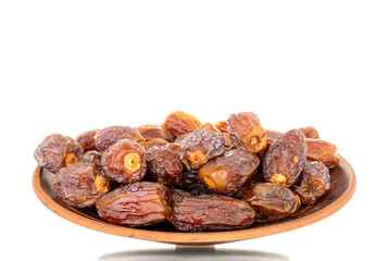 Dried sweet dates with homemade dishes isolated on white background, close-up.
