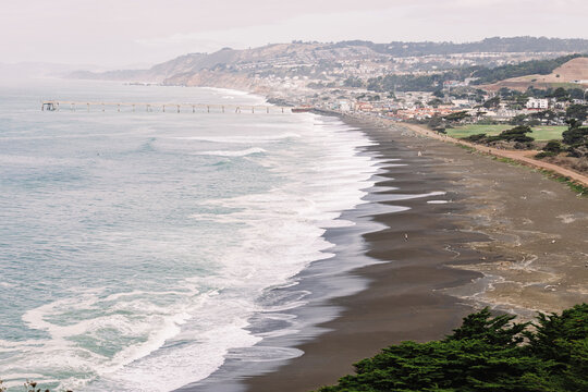 Coastal view of a sandy beach on foggy morning, Pacifica, California