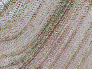 Fototapeta premium The fishing net is like a background on the wall. 