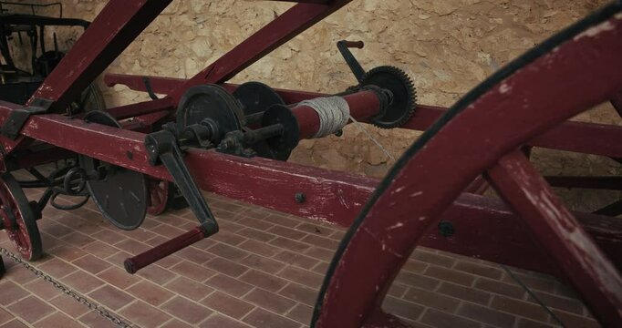 Close up of a vintage wooden cart with metal gears in Kumrovec, Croatia