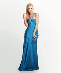 Happy woman, portrait or fashion with satin gown for style, glamour or elegance on a white studio...