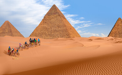 A Group of tourist riding a camel - Camels in Giza Pyramid Complex - Cairo, Egypt