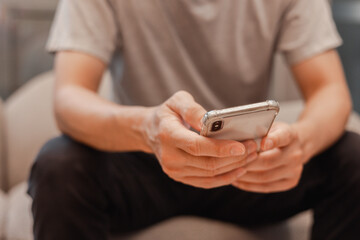 Social media and digital online concept, man using smart phone. The concept of living on vacation and playing social media. Social Distancing ,Working From Home