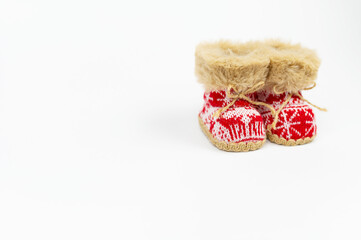 Red Nicholas Christmas boots isolated on white background. Winter boots, snow boots. New Year. NATIONAL SHOE THE WORLD DAY. Navidad