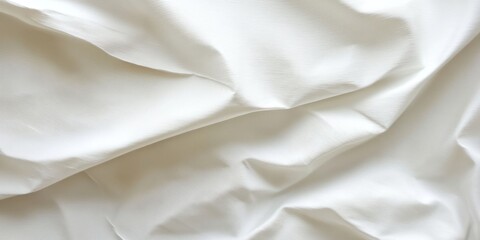 Obraz premium Close up of smooth, white fabric with soft wrinkles.