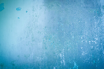 The abstract background is a blue wall texture with a little peeling