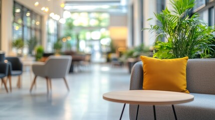 A well-lit modern office space featuring contemporary furniture basks in natural light. The background is intentionally blurred to emphasize the foreground elements. 