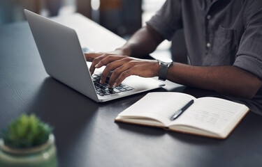 Person, hands and laptop in office for business, planning and update work schedule. Man, typing and computer in workplace with journal, email contact and research for company ecommerce with notes